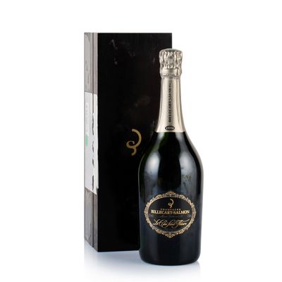 a bottle of champagne in front of a black box