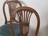 two chairs that are next to each other on the floor