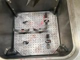 a metal sink that has some tools in it