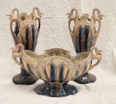 two vases that are sitting next to each other on a table
