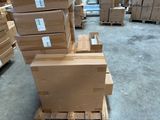 boxes stacked on a pallet in a warehouse with pallets in the background
