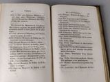 an open book on a table with a number of words on it