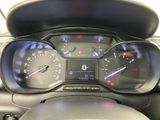 a close up of a car dashboard with a speedometer and gauges
