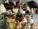 a glass shelf filled with different types of figurines