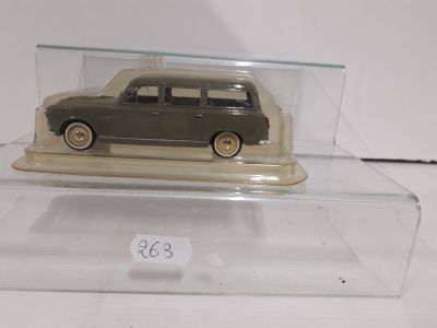 a toy car in a clear case on a table