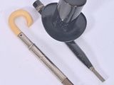 a picture of a pair of scissors and a hat on a white surface