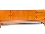 an image of a wooden sideboard with drawers and drawers on it