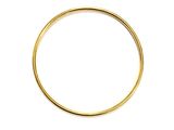 a close up of a gold ring on a white background