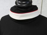 an image of a mannequin wearing a black and white collar