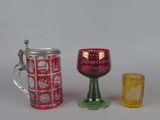 three different types of glassware on a white surface
