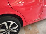a red car that is parked in a garage