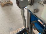 a machine that is sitting on a pallet in a warehouse