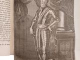 an old book with a picture of a man in a suit of armor