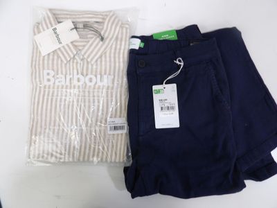 two pairs of pants and a shirt on a table