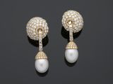 a pair of pearl and diamond ear clips