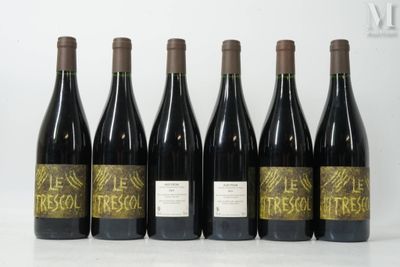 six bottles of wine are lined up in a row on a table