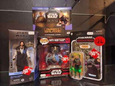 several star wars action figures are on display in a display case