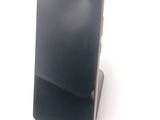 a cell phone that is sitting on top of a stand
