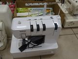 a sewing machine that is sitting on the floor