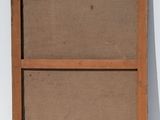 an old wooden frame with a piece of paper taped to it