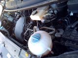 a picture of a car engine with its hood open