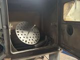 a metal box with a clock inside of it