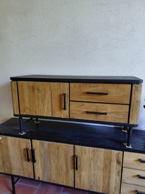 a wooden cabinet with drawers and drawers on top of it