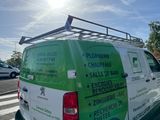 a van that is parked on the side of the road
