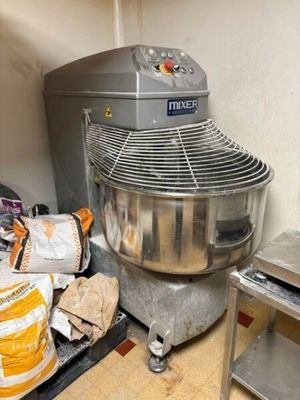 an image of a kitchen with a mixer and other items