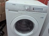 a washing machine and a dryer sitting next to each other