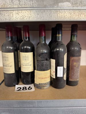 many bottles of wine on a shelf in a store
