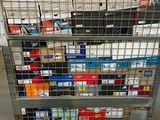 a metal cart with many boxes on top of it
