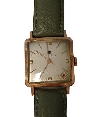 an image of a wrist watch with a green strap