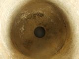an image of a toilet bowl with a hole in it
