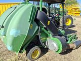 an image of a tractor that is parked in a field