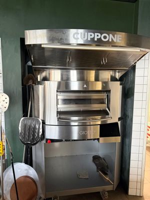 an image of a commercial pizza oven in a kitchen