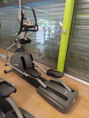 two stationary exercise bikes in a gym room