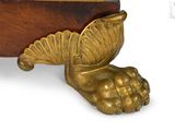 brass figurine of a bird on a stand with a wooden base