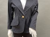 a mannequin wearing a gray jacket and black pants