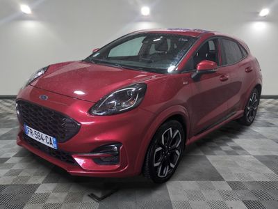 a red 2020 ford kadgo is parked in a garage