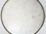 a white marble table top with a metal frame around it