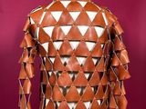 the back of a brown leather jacket on a mannequin mannequin mannequin mannequin mannequin mannequin mannequin manne