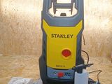 a yellow and black stanley vacuum on the floor
