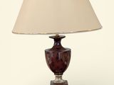 a lamp that is sitting on a table with a lamp shade on it