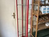 a glass display case in the corner of a room