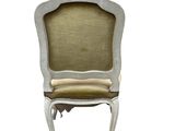 an image of a chair with a beige upholstered seat