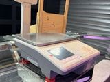 a machine that is sitting on a conveyor belt
