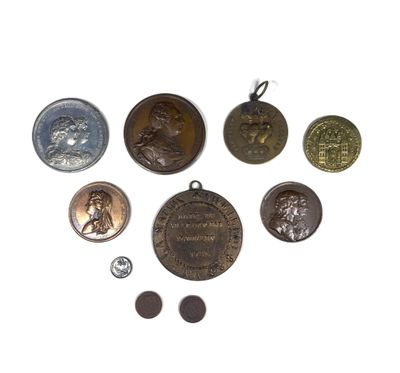 some of the medals are on display on a white surface