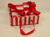 a red and white box with a red ribbon on it