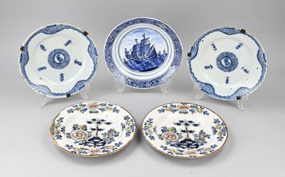four blue and white plates with flowers and a ship on them